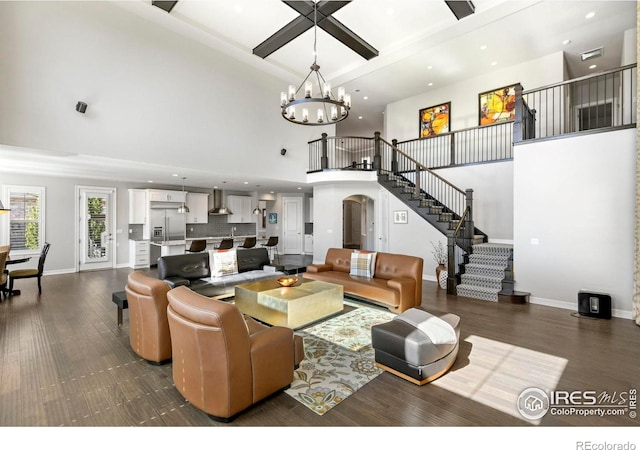 1440 Eversole Dr, Broomfield, CO 80023 - living room with a notable chandelier, stairway, recessed lighting, and baseboards