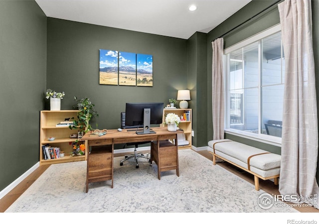 office featuring recessed lighting, baseboards, and wood finished floors