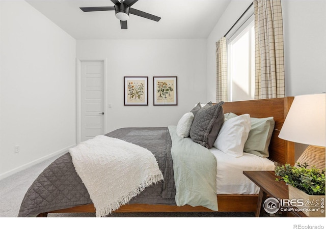 carpeted bedroom featuring a ceiling fan and baseboards