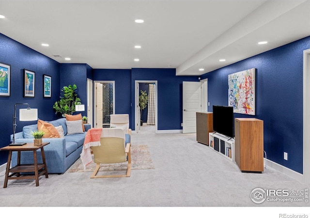 living area with carpet flooring, recessed lighting, and baseboards