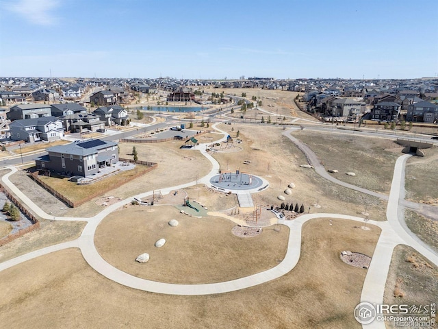 birds eye view of property with a residential view