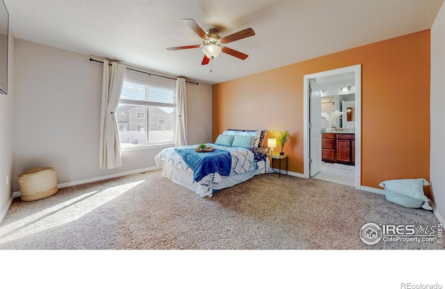 bedroom with ceiling fan, baseboards, carpet floors, and connected bathroom