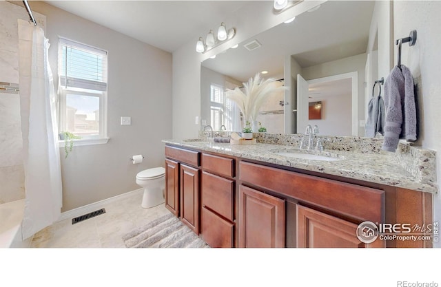 bathroom with a sink, visible vents, toilet, and a shower with curtain