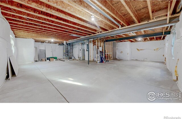 unfinished basement with water heater