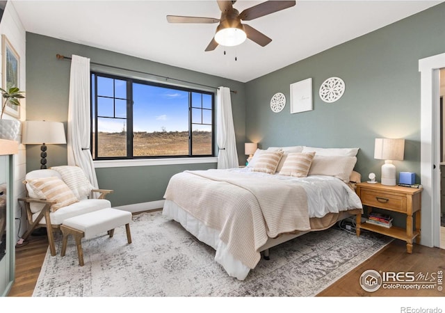 4528 Del Colina Way, Laporte, CO 80535 - bedroom featuring wood finished floors, baseboards, and ceiling fan