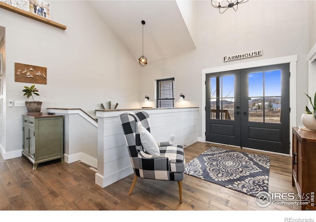 4528 Del Colina Way, Laporte, CO 80535 - entryway with high vaulted ceiling, wood finished floors, french doors, and baseboards