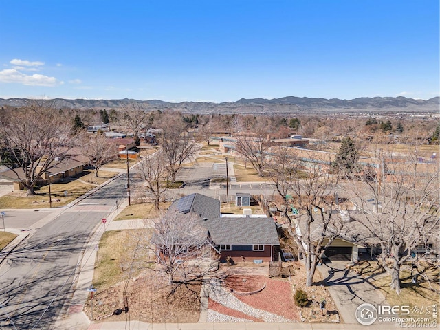 birds eye view of property with a mountain view