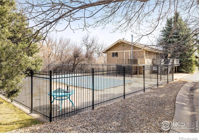 view of swimming pool with a fenced in pool, a patio, and fence