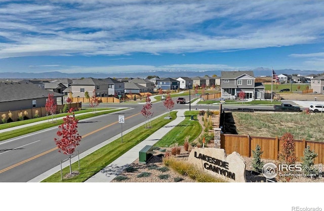 view of street featuring sidewalks, a residential view, and curbs