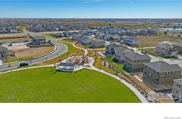 aerial view with a residential view and a water view