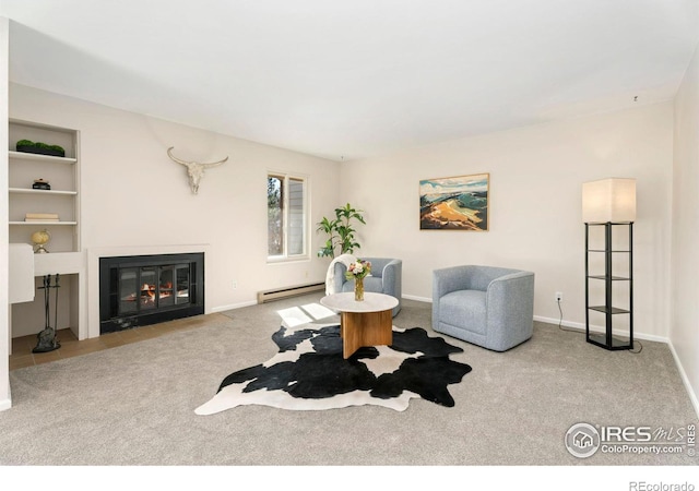 living room featuring built in features, carpet, baseboards, a baseboard radiator, and a fireplace with flush hearth