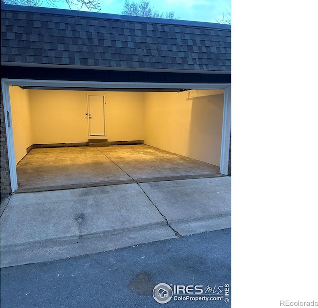 garage with concrete driveway