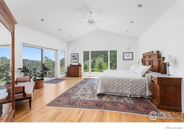 bedroom featuring access to exterior, ceiling fan, recessed lighting, wood finished floors, and high vaulted ceiling