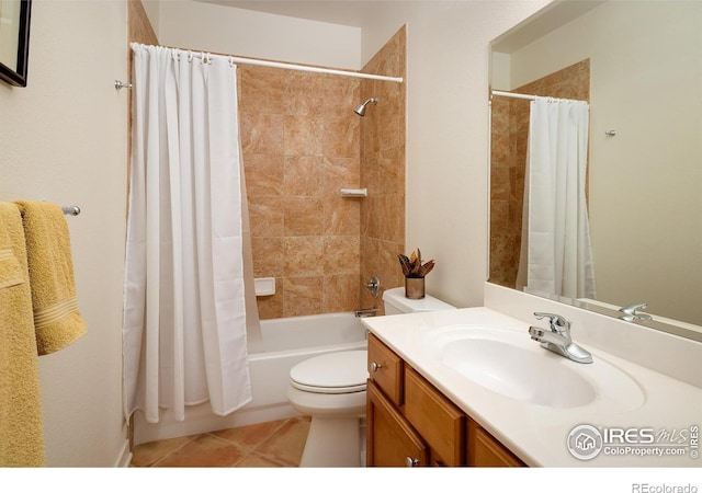 bathroom featuring tile patterned flooring, toilet, vanity, and shower / bath combo