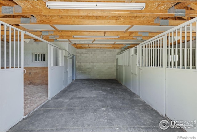 view of horse barn featuring visible vents