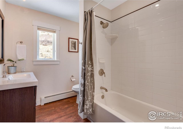 full bathroom featuring shower / bathtub combination with curtain, toilet, wood finished floors, baseboard heating, and vanity