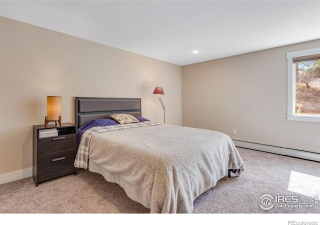 bedroom with recessed lighting, light colored carpet, baseboards, and a baseboard radiator