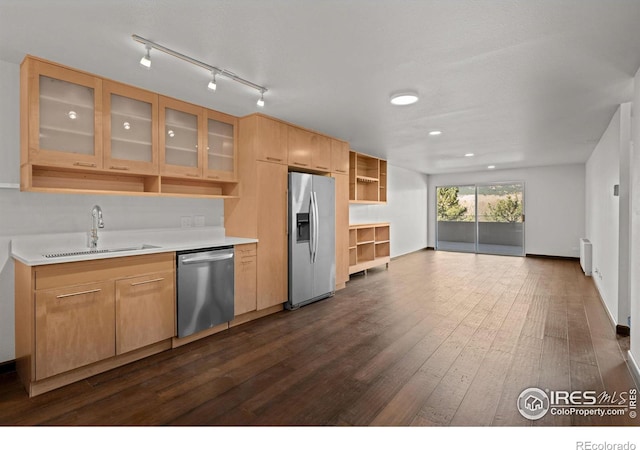 kitchen featuring a sink, radiator, appliances with stainless steel finishes, dark wood-style floors, and open shelves