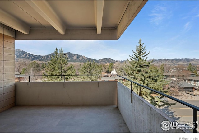 balcony featuring a mountain view