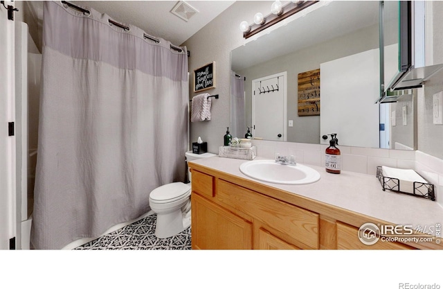 full bath with vanity, toilet, and visible vents