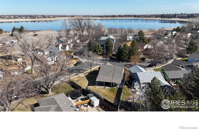 bird's eye view with a residential view and a water view