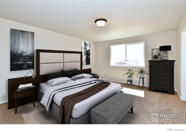 bedroom featuring carpet flooring and baseboards