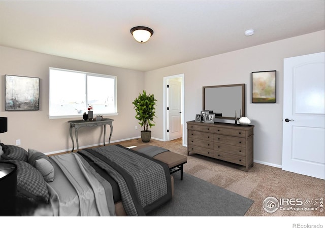 carpeted bedroom with baseboards