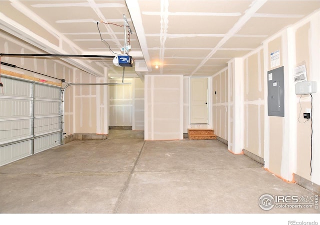 garage with electric panel and a garage door opener