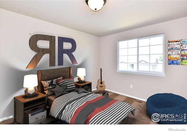 carpeted bedroom featuring baseboards