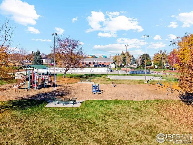 community play area featuring a lawn