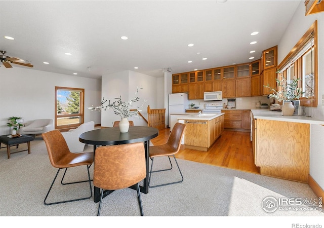 dining area with recessed lighting, light wood-type flooring, and a ceiling fan