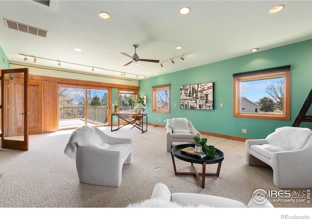 living area featuring recessed lighting, visible vents, carpet flooring, and a ceiling fan