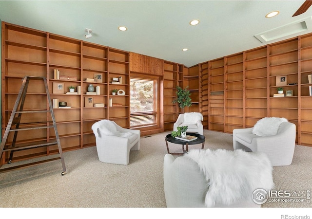 living room featuring recessed lighting, visible vents, and carpet flooring