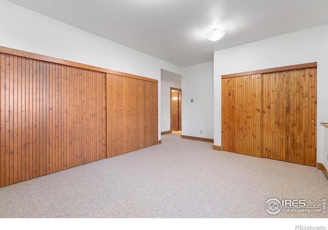 unfurnished bedroom with carpet