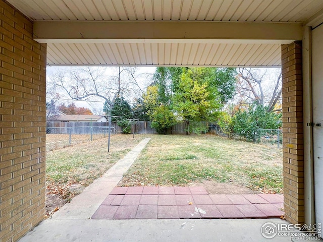 view of yard featuring a patio and a fenced backyard