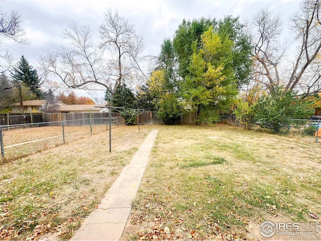 view of yard with a fenced backyard