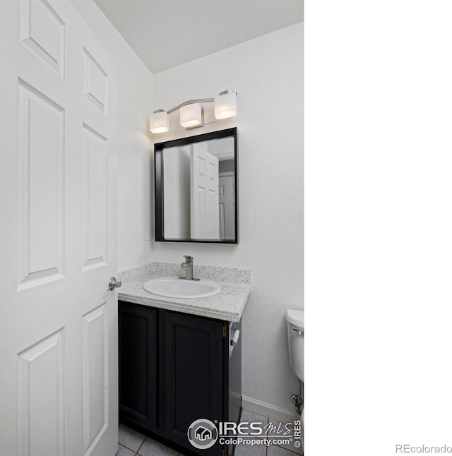 bathroom with toilet and vanity