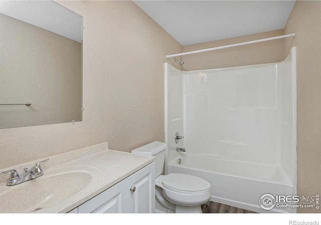 full bathroom featuring shower / bath combination, toilet, wood finished floors, and vanity