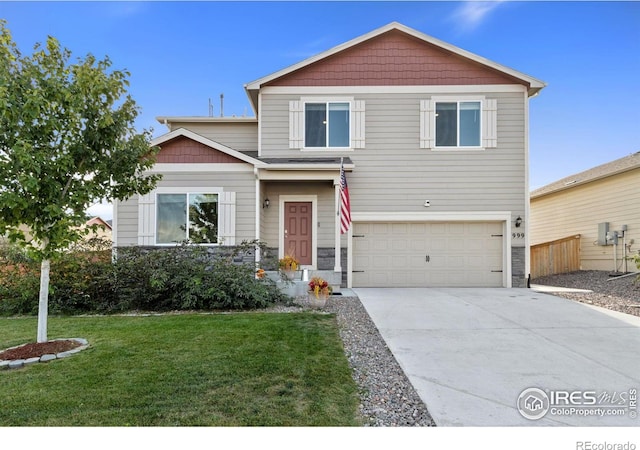 view of front of property with a front yard, concrete driveway, a garage, and stone siding