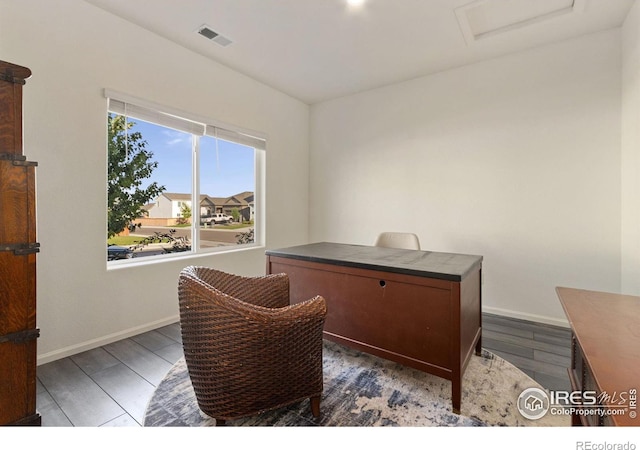 office featuring dark wood-style floors, visible vents, attic access, and baseboards