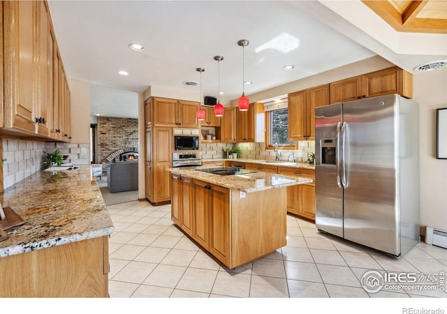 kitchen with a sink, black appliances, a fireplace, and light tile patterned floors