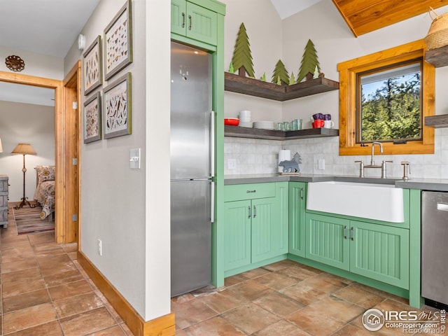 726 Alpine Dr, Estes Park, CO 80517 - kitchen featuring stainless steel appliances, light stone finish flooring, and backsplash