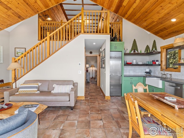 726 Alpine Dr, Estes Park, CO 80517 - living room featuring stairs, wood ceiling, stone finish flooring, high vaulted ceiling, and recessed lighting