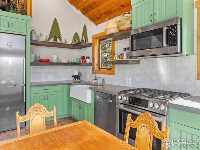 726 Alpine Dr, Estes Park, CO 80517 - kitchen featuring stainless steel appliances, open shelves, backsplash, green cabinets, and lofted ceiling