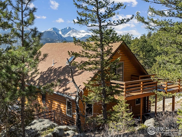 726 Alpine Dr, Estes Park, CO 80517 - view of side of home with a deck with mountain view