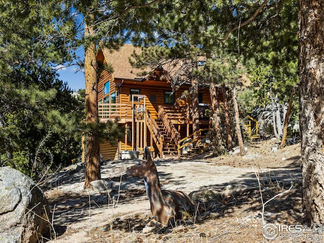726 Alpine Dr, Estes Park, CO 80517 - back of house featuring faux log siding, stairs, and a shingled roof