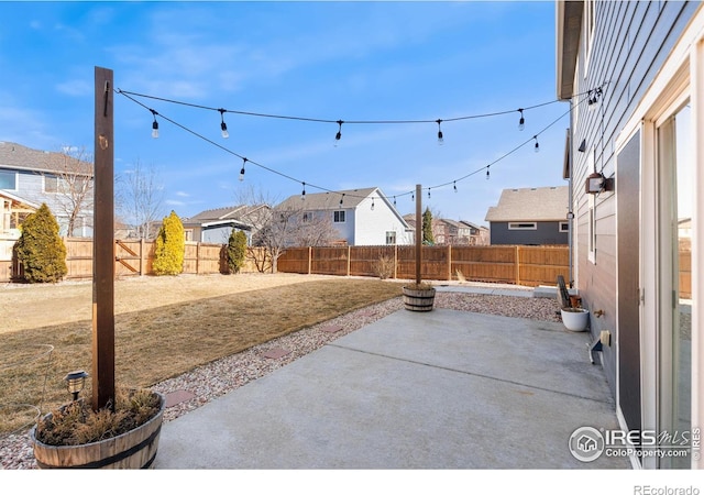 view of patio with a fenced backyard and a residential view