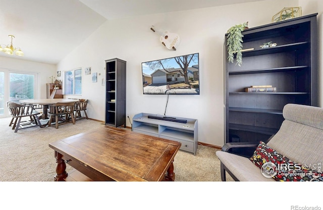 carpeted living area with vaulted ceiling and baseboards