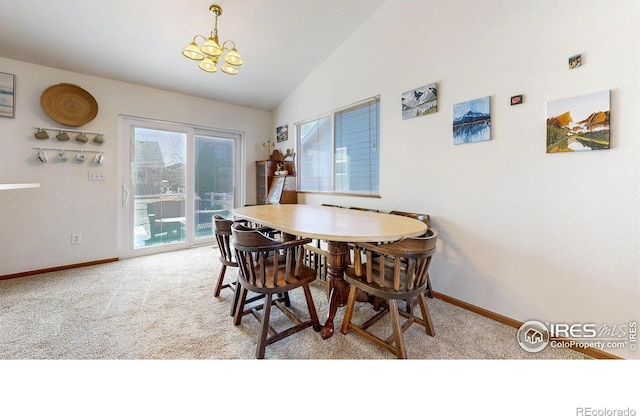 dining space featuring a chandelier, baseboards, carpet, and vaulted ceiling