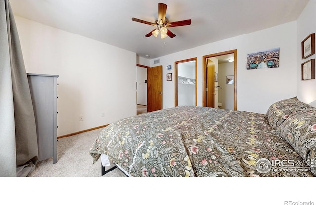 carpeted bedroom with visible vents, baseboards, and ceiling fan